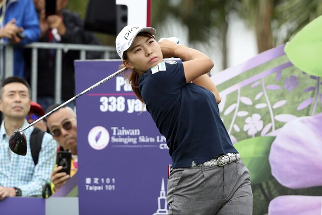 Hinako Shibuno of Japan watches her tee shot on the first hole during the first round of the Taiwan Swinging Skirts LPGA at the Miramar Golf Country Club in New Taipei City, Taiwan, Thursday, Oct. 31, 2019. (AP Photo/Chiang Ying-ying)