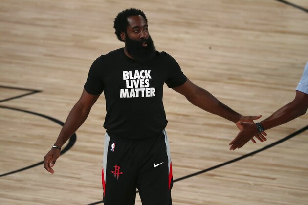 Houston Rockets guard James Harden (13) warms up before an NBA basketball game against the Philadelphia 76ers Friday, Aug. 14, 2020, in Lake Buena Vista, Fla. (Kim Klement/Pool Photo via AP)