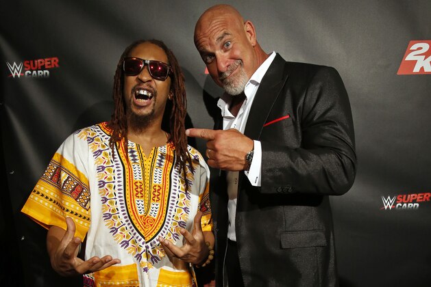 IMAGE DISTRIBUTED FOR 2K - WWE Legend Bill Goldberg and performer Lil Jon, left, share a laugh at the WWE 2K17 SummerSlam Kickoff Event in New York, on Friday, Aug. 19, 2016. (Adam Hunger/AP Images for 2K)