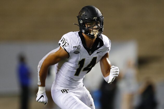 FILE - In this Sept. 6, 2019, file photo, Wake Forest wide receiver Sage Surratt (14) runs a pass route during an NCAA football game in Houston. The North Carolina-Wake Forest game will put brothers Sage and Chazz Surratt on opposite sides for the first time. Sage is a top receiver for the Demon Deacons, while Chazz has moved from quarterback to linebacker for the Tar Heels -- raising the odds that the two meet in a collision at some point Friday night. (AP Photo/Matt Patterson, File)