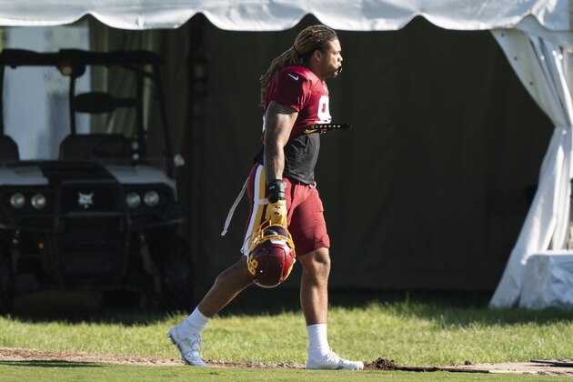 Washington defensive end Chase Young (99) arrives for practice at the team's NFL football training facility, Tuesday, Aug. 18, 2020, in Ashburn, Va. (AP Photo/Alex Brandon)