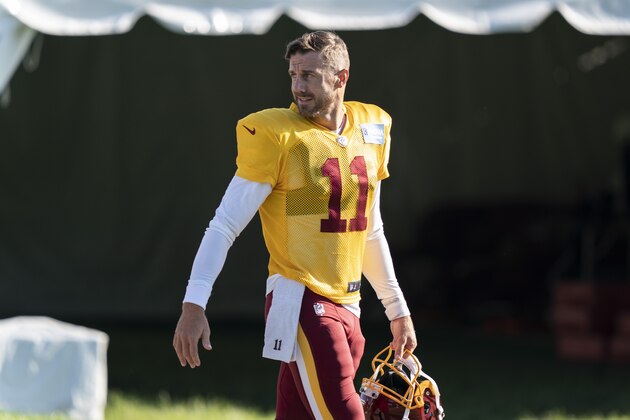Washington quarterback Alex Smith (11) walks to practice at the team's NFL football training facility, Tuesday, Aug. 18, 2020, in Ashburn, Va. (AP Photo/Alex Brandon)