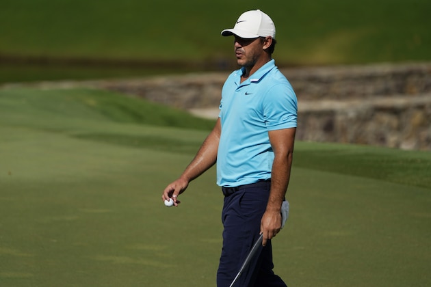Brooks Koepka walks on the on the 15th green during the second round of the Wyndham Championship golf tournament at Sedgefield Country Club on Friday, Aug. 14, 2020, in Greensboro, N.C. (AP Photo/Chris Carlson) Brooks Koepka walks on the on the 15th green during the second round of the Wyndham Championship golf tournament at Sedgefield Country Club on Friday, Aug. 14, 2020, in Greensboro, N.C. (AP Photo/Chris Carlson)
