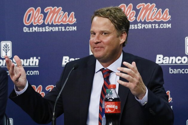 Lane Kiffin responds to reporters questions at a news conference, after being introduced to Mississippi fans as their new NCAA college football coach, at The Pavilion, a multipurpose arena on the campus in Oxford, Miss., Monday, Dec. 9, 2019. Kiffin was previously, the football coach for three years at Florida Atlantic. (AP Photo/Rogelio V. Solis)