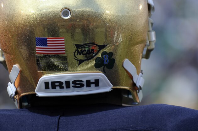 To honor those injured and killed in the Boston Marathon bombings, Notre Dame players wore helmets with a B and a shamrock logo on them during the Blue-Gold spring NCAA college football game, Saturday, April 20, 2013, in South Bend, Ind. (AP Photo/Joe Raymond)