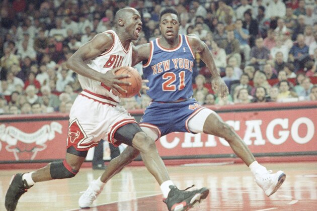 Chicago’s Michael Jordan races past New York’s Gerald Wilkins (21) as he goes to the hoop during the second half of Sunday’s NBA playoff game in Chicago on April 29, 1991. Jordan chipped in 26 points as the Bulls beat the Knicks 89-79 to go up 2-0 in the best-of-five series. (AP Photo/Fred Jewell)