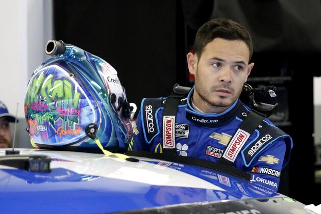 FILE - In this Feb. 14, 2020, file photo, Kyle Larson gets ready to climb into his car to practice for the NASCAR Daytona 500 auto race at Daytona International Speedway in Daytona Beach, Fla. Kyle Larson used a racial slur on a live stream Sunday. April 12, 2020, during a virtual race â€” the second driver in a week to draw scrutiny while using the online racing platform to fill time during the coronavirus pandemic.(AP Photo/Terry Renna, File)