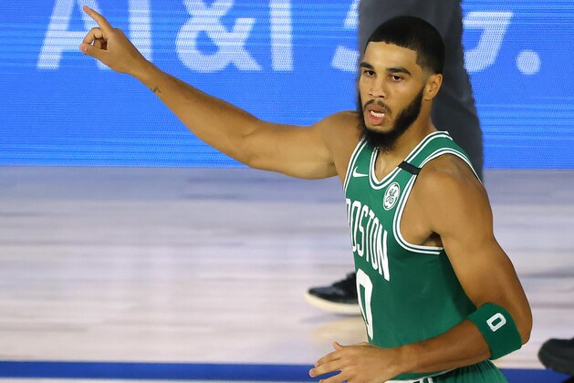 Jayson Tatum of the Boston Celtics celebrates a three-point shot against the Philadelphia 76ers during the first half of Game 2 of an NBA basketball first-round playoff series, Wednesday, Aug. 19, 2020, in Lake Buena Vista, Fla. (Kevin C. Cox/Pool Photo via AP)