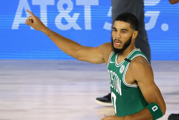 Jayson Tatum of the Boston Celtics celebrates a three-point shot against the Philadelphia 76ers during the first half of Game 2 of an NBA basketball first-round playoff series, Wednesday, Aug. 19, 2020, in Lake Buena Vista, Fla. (Kevin C. Cox/Pool Photo via AP)