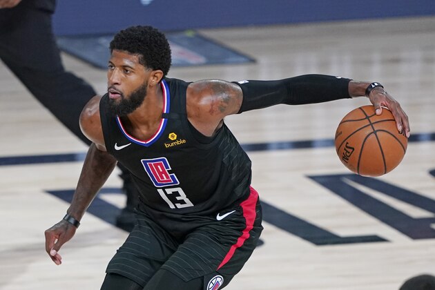 Los Angeles Clippers' Paul George (13) moves the ball against the Dallas Mavericks during the second half of an NBA basketball game Wednesday, Aug. 19, 2020, in Lake Buena Vista, Fla. (AP Photo/Ashley Landis, Pool)