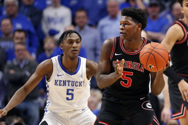 Georgia's Anthony Edwards, right, looks for an opening on Kentucky's Immanuel Quickley during an NCAA college basketball game in Lexington, Ky., Tuesday, Jan 21, 2020. Kentucky won 89-79. (AP Photo/James Crisp)