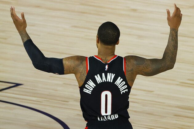 Portland Trail Blazers' Damian Lillard calls for a foul against the Memphis Grizzlies during the second half of an NBA basketball game Saturday, Aug. 15, 2020, in Lake Buena Vista, Fla. (Kevin C. Cox/Pool Photo via AP)