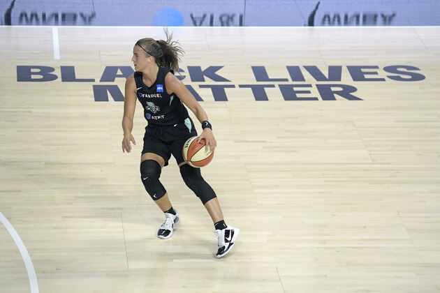 New York Liberty guard Sabrina Ionescu sets up a shot during the second half of a WNBA basketball game against the Seattle Storm, Saturday, July 25, 2020, in Bradenton, Fla. (AP Photo/Phelan M. Ebenhack)