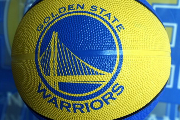The new Golden State Warrior logo is seen on a basketball for sale at the Warrior team store Wednesday, July 14, 2010, in Oakland, Calif.  Golden State Warriors owner Chris Cohan reached an agreement Thursday to sell the franchise for a record $450 million to Boston Celtics minority partner Joe Lacob and Mandalay Entertainment CEO Peter Guber. (AP Photo/Ben Margot)