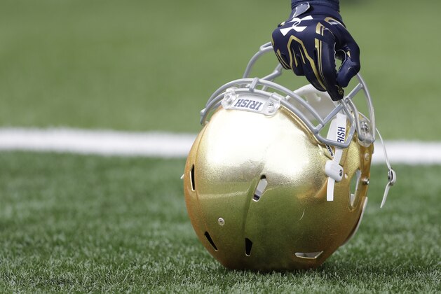 A Notre Dame player holds his helmet after running onto to field before an NCAA college football game Saturday, Oct. 29, 2016, in South Bend, Ind.   (AP Photo/Darron Cummings)