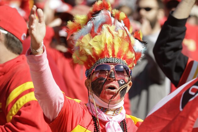 A Kansas City Chiefs fan wears a headdress before the first half of an NFL football game against the New York Jets in Kansas City, Mo., Sunday, Nov. 2, 2014. (AP Photo/Charlie Riedel)