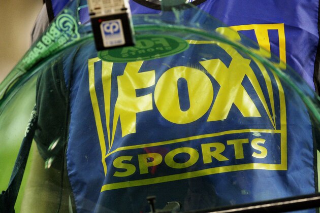 A Fox Sports logo worn by a parabolic microphone operator on the sidelines of a game between the Arizona Cardinals and the Seattle Seahawks in the fourth quarter of an NFL football game Sunday, Nov. 15, 2009, in Glendale, Ariz.  The Cardinals defeated the Seahawks 31-20. (AP Photo/Ross D. Franklin)