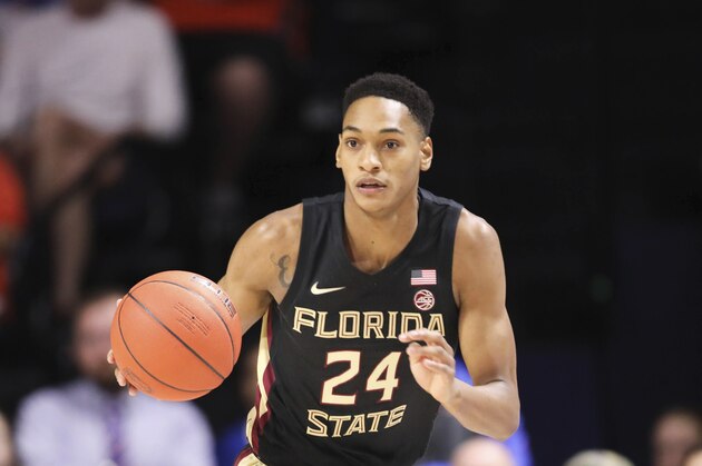 Florida State guard Devin Vassell (24) dribbles up court against Florida during the first half of an NCAA college basketball game Sunday, Nov. 10, 2019, in Gainesville, Fla. (AP Photo/Matt Stamey)