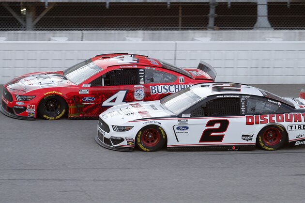Kevin Harvick (4) competes with Brad Keselowski (2) during a NASCAR Cup Series auto race at Michigan International Speedway in Brooklyn, Mich., Saturday, Aug. 8, 2020. (AP Photo/Paul Sancya)