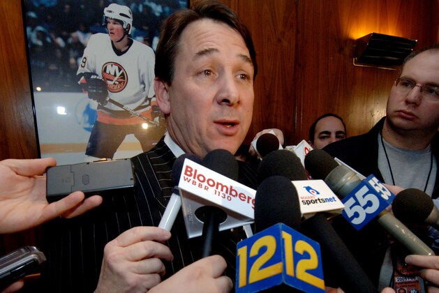 New York Islanders' general manager Mike Milbury talks to the media after team owner Charles Wang announced that Milbury will step aside as general manager after a replacement is found, during a news conference in Uniondale, N.Y., Thursday, Jan. 12, 2006. Wang also announced that Brad Shaw will  replace the recently fired Steve Stirling as the Islanders' coach.  (AP Photo/Henny Ray Abrams)