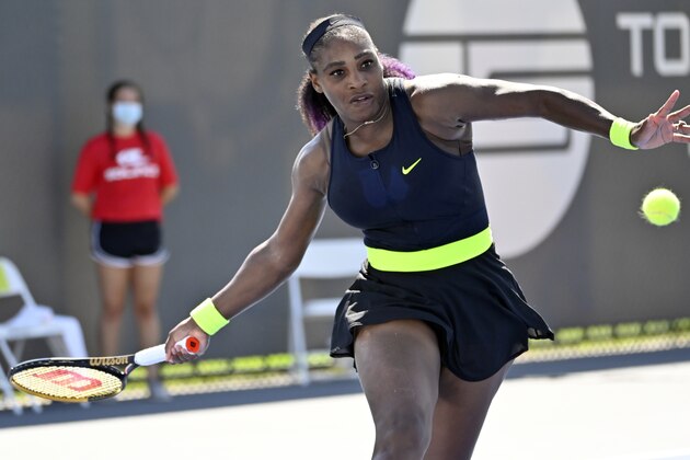 Serena Williams returns a shot to Shelby Rogers during action in their WTA tennis tournament match in Nicholasville, Ky., Friday, Aug. 14, 2020. (AP Photo/Timothy D. Easley)