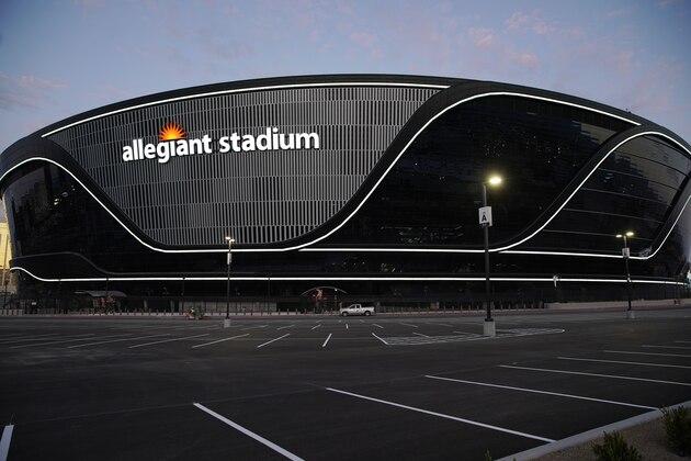 Lights adorn Allegiant Stadium, new home of the Las Vegas Raiders football team, as it nears completion Wednesday, July 22, 2020, in Las Vegas. The stadium will also serve as the home for the UNLV football team. (AP Photo/John Locher)
