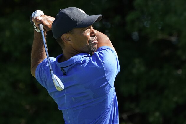 Tiger Woods watches his shot on the 16th tee in the first round of the Northern Trust golf tournament at TPC Boston, Thursday, Aug. 20, 2020, in Norton, Mass. (AP Photo/Charles Krupa)