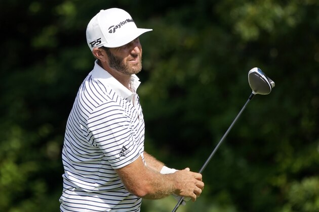Dustin Johnson watches his shot off the 14th tee during the second round of the Northern Trust golf tournament at TPC Boston, Friday, Aug. 21, 2020, in Norton, Mass. (AP Photo/Charles Krupa)
