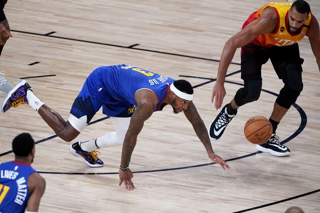 Denver Nuggets' Torrey Craig (3) and Utah Jazz's Rudy Gobert chase down a loose ball during the second half of an NBA basketball first round playoff game Friday, Aug. 21, 2020, in Lake Buena Vista, Fla. (AP Photo/Ashley Landis, Pool) Denver Nuggets' Torrey Craig (3) and Utah Jazz's Rudy Gobert chase down a loose ball during the second half of an NBA basketball first round playoff game Friday, Aug. 21, 2020, in Lake Buena Vista, Fla. (AP Photo/Ashley Landis, Pool)