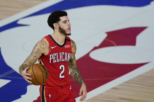 New Orleans Pelicans' Lonzo Ball (2) makes his way down the court during an NBA basketball game against the Memphis Grizzlies Monday, Aug. 3, 2020, in Lake Buena Vista, Fla. (AP Photo/Ashley Landis, Pool)