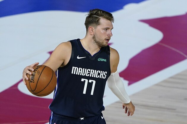 Dallas Mavericks' Luka Doncic (77) makes his way down the court during an NBA basketball game against the Los Angeles Clippers Thursday, Aug. 6, 2020, in Lake Buena Vista, Fla. (AP Photo/Ashley Landis, Pool)