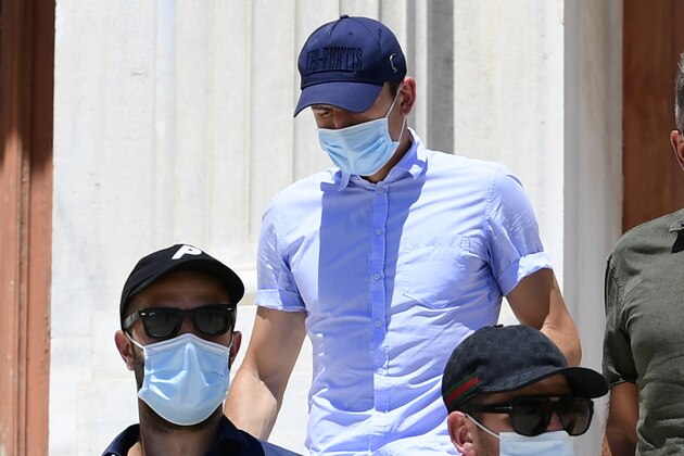 England soccer player Harry Maguire, center, leaves a court building on the Aegean island of Syros, Greece, on Saturday, Aug. 22, 2020. The Manchester United captain was arrested during a brawl on the neighbouring holiday island of Mykonos. (AP Photo/Michael Varaklas)