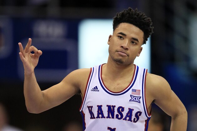 FILE - In this March 4, 2020, file photo, Kansas guard Devon Dotson celebrates a 3-point basket during the second half of the team's NCAA college basketball game against TCU in Lawrence, Kan. Dotson is entering the NBA draft after leading the Big 12 Conference in scoring his sophomore season. “In basketball, this has always been my ultimate dream and my time at KU has prepared me,” Dotson said Monday, April 13, 2020, in a news release.(AP Photo/Orlin Wagner, File)