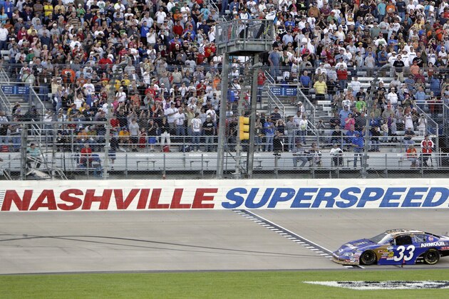 FILE -- In this April 3, 2010, file photo, Kevin Harvick takes the checkered flag at the finish line to win the NASCAR Nationwide Series Nashville 300 auto race at Nashville Superspeedway in Gladeville, Tenn. NASCAR is set to return to the track in 2021. Nashville Superspeedway will hold a Cup race for the first time next season.  It ends NASCARâ€™s decade-long drought at the track. (AP Photo/Mark Humphrey, File)