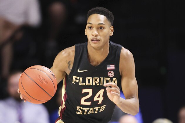 Florida State guard Devin Vassell (24) dribbles up court against Florida during the first half of an NCAA college basketball game Sunday, Nov. 10, 2019, in Gainesville, Fla. (AP Photo/Matt Stamey)