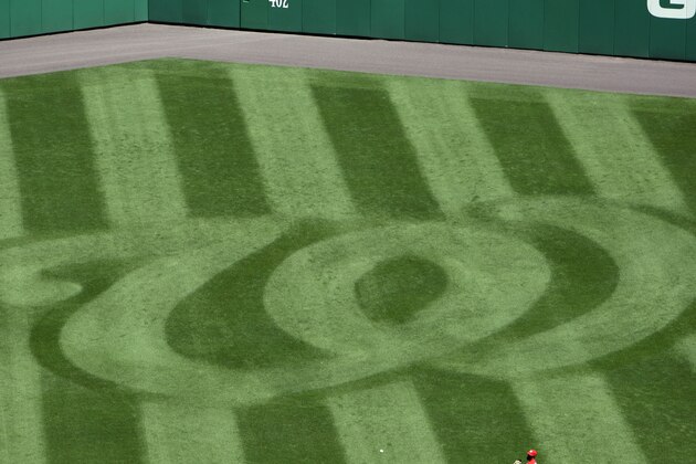 Washington Nationals center fielder Roger Bernadina warms up near the Nationals logo on the grass before a baseball game with the Florida Marlins at Nationals Park in Washington Saturday, April 18, 2009. (AP Photo/Alex Brandon) Washington Nationals center fielder Roger Bernadina warms up near the Nationals logo on the grass before a baseball game with the Florida Marlins at Nationals Park in Washington Saturday, April 18, 2009. (AP Photo/Alex Brandon)