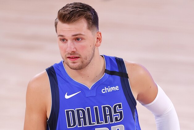 Dallas Mavericks' Luka Doncic runs on the court before Game 3 of an NBA basketball first-round playoff series against the Los Angeles Clippers, Friday, Aug. 21, 2020, in Lake Buena Vista, Fla. (Mike Ehrmann/Pool Photo via AP)