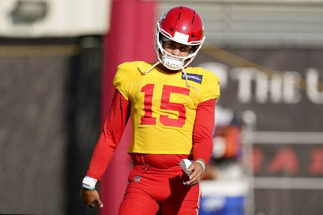Kansas City Chiefs quarterback Patrick Mahomes warms up during an NFL football training camp practice Friday, Aug. 21, 2020, in Kansas City, Mo. (AP Photo/Charlie Riedel)