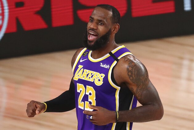 Los Angeles Lakers forward LeBron James (23) reacts after scoring against the Portland Trail Blazers during the first half of Game 3 of an NBA basketball first-round playoff series, Saturday, Aug. 22, 2020, in Lake Buena Vista, Fla. (Kim Klement/Pool Photo via AP)