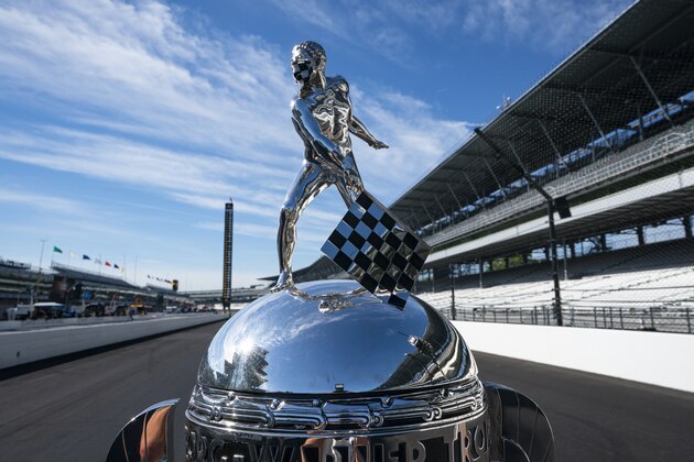 The top of the Borg-Warner Trophy  complete with checkered flag mask, is shown on the start/finish line before the the practice session for the Indianapolis 500 auto race at Indianapolis Motor Speedway in Indianapolis, Friday, Aug. 21, 2020. (AP Photo/Michael Conroy)