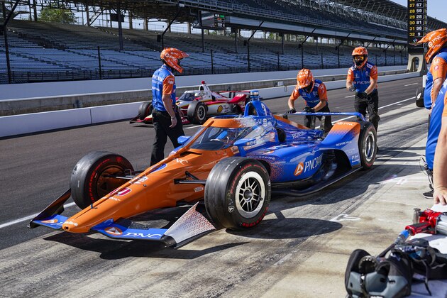 Scott Dixon, of New Zealand, pulls out of the pit area during practice for the Indianapolis 500 auto race at Indianapolis Motor Speedway in Indianapolis, Sunday, Aug. 16, 2020. Dixon returned to the track after a crash earlier in the practice e session. (AP Photo/Michael Conroy)