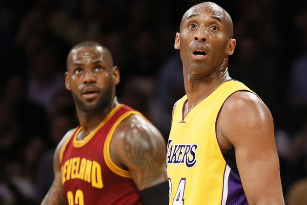 Los Angeles Lakers' Kobe Bryant, right, and Cleveland Cavaliers' LeBron James, left, are seen on the court together during the first half of an NBA basketball game, Thursday, March 10, 2016, in Los Angeles. (AP Photo/Danny Moloshok)