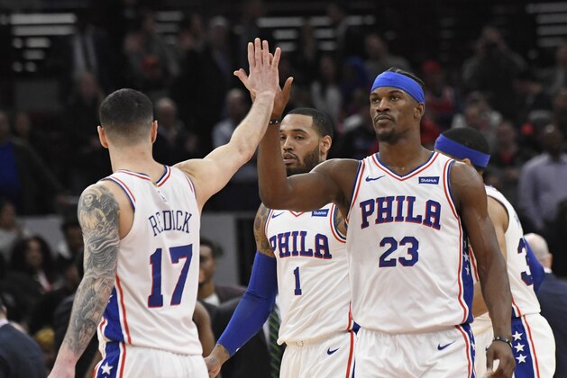 Philadelphia 76ers guards Jimmy Butler (23) and JJ Redick (17) celebrate a basket against the Chicago Bulls during the second half of an NBA basketball game Wednesday, March 6, 2019, in Chicago. The Bulls won 108-107. (AP Photo/David Banks)