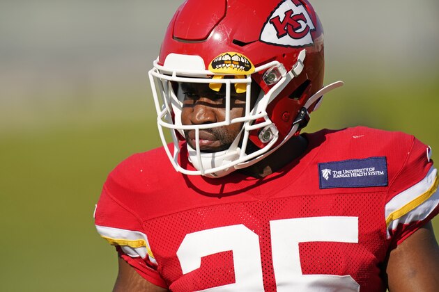 Kansas City Chiefs running back Clyde Edwards-Helaire watches a drill during an NFL football training camp practice Friday, Aug. 21, 2020, in Kansas City, Mo. (AP Photo/Charlie Riedel)