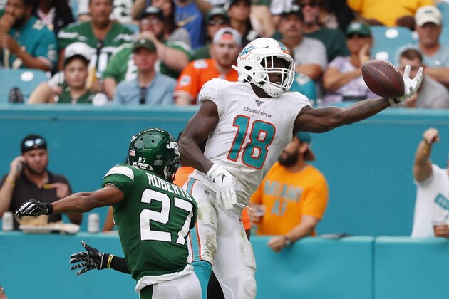 Miami Dolphins wide receiver Preston Williams (18) misses the pass against New York Jets cornerback Darryl Roberts (27) during the second half of an NFL football game, Sunday, Nov. 3, 2019, in Miami Gardens, Fla. (AP Photo/Wilfredo Lee)