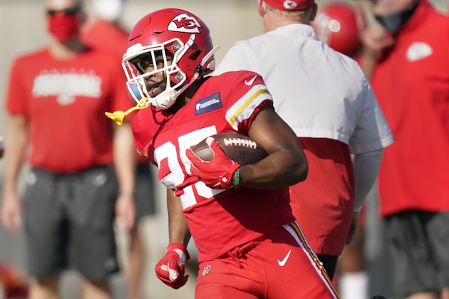 Kansas City Chiefs running back Clyde Edwards-Helaire runs the ball during an NFL football training camp Friday, Aug. 14, 2020, in Kansas City, Mo. (AP Photo/Charlie Riedel)