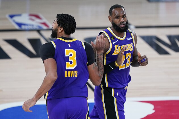 Los Angeles Lakers forward Anthony Davis (3) and forward LeBron James (23) celebrates a play during the second half of an NBA basketball first round playoff game against the Portland Trail Blazers, Saturday, Aug. 22, 2020, in Lake Buena Vista, Fla. (AP Photo/Ashley Landis, Pool)
