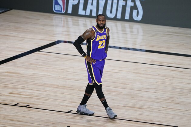 Los Angeles Lakers forward LeBron James (23) walks on the court during the first half of an NBA basketball first round playoff game against the Portland Trail Blazers, Saturday, Aug. 22, 2020, in Lake Buena Vista, Fla. (AP Photo/Ashley Landis, Pool)