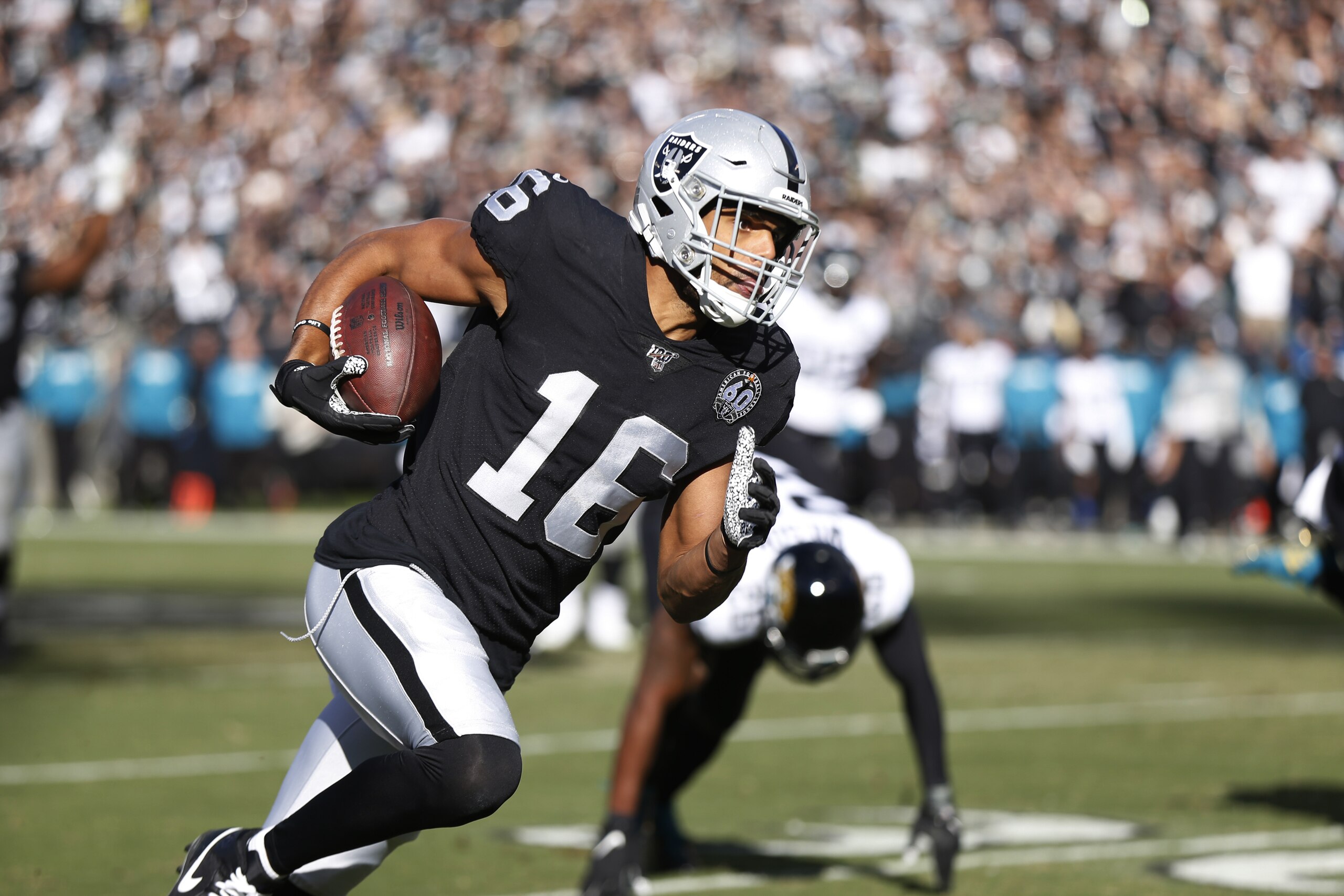 Oakland Raiders wide receiver Tyrell Williams runs with the ball for a touchdown during the first half of an NFL football game against the Jacksonville Jaguars in Oakland, Calif., Sunday, Dec. 15, 2019. (AP Photo/D. Ross Cameron)