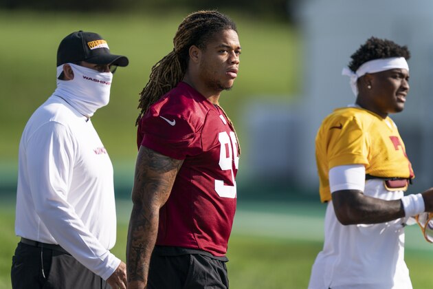 Washington head coach Ron Rivera, left, defensive end Chase Young (99) and quarterback Dwayne Haskins Jr., (7) arrive for practice at the team's NFL football training facility, Thursday, Aug. 20, 2020, in Ashburn, Va. (AP Photo/Alex Brandon) Washington head coach Ron Rivera, left, defensive end Chase Young (99) and quarterback Dwayne Haskins Jr., (7) arrive for practice at the team's NFL football training facility, Thursday, Aug. 20, 2020, in Ashburn, Va. (AP Photo/Alex Brandon)